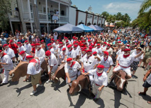 Ernest Hemingway look- alikes kick off the Running of the Bulls Saturday, July 19, 2014, in Key West, Fla. The whimsical event, a parody of its namesake in Pamplona, Spain, is one of many events during Key West's Hemingway Days festival that continues through Sunday, July 20. Hemingway lived and wrote in Key West throughout most of the 1930s. FOR EDITORIAL USE ONLY (Andy Newman/Florida Keys News Bureau/HO)